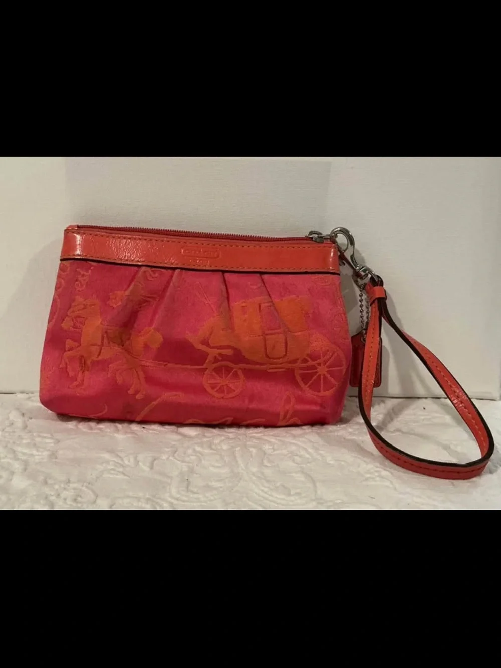 Pink and Orange Coach Wristlet